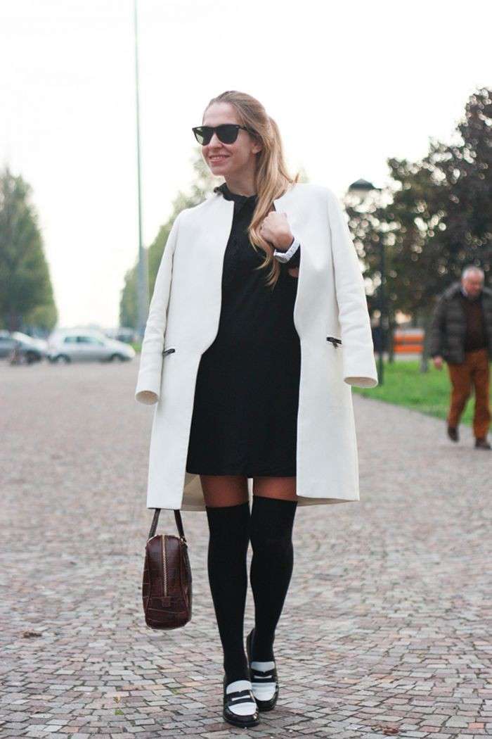 Outfit elegante con parigine nere e cappotto bianco
