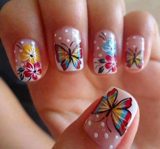French manicure con farfalle multicolor