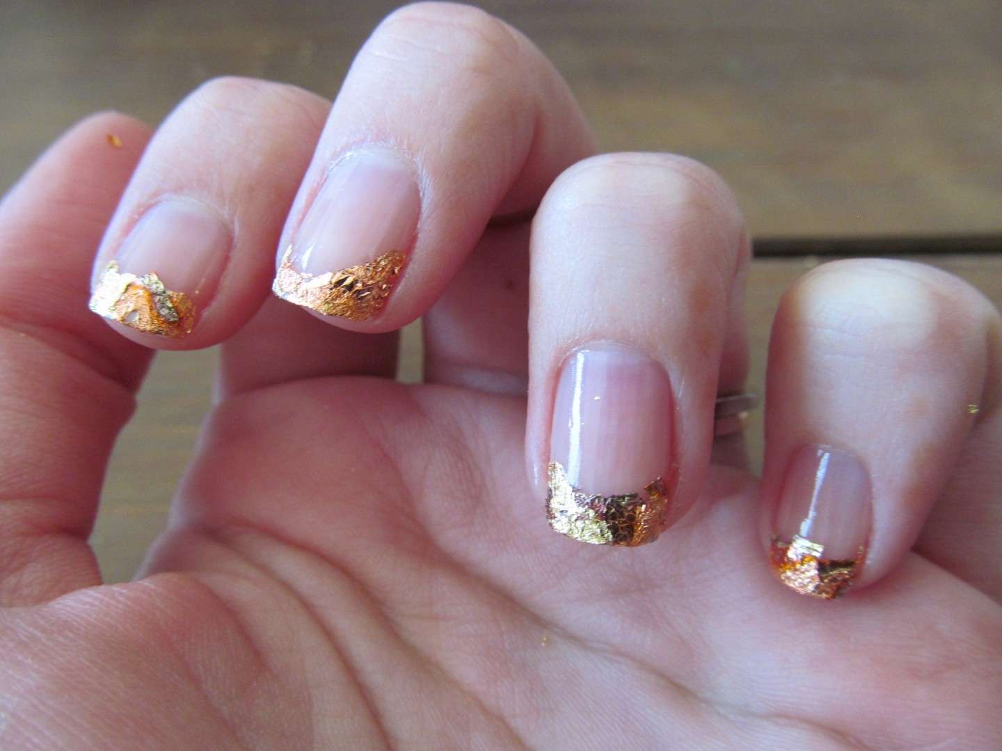 Una gold french manicure