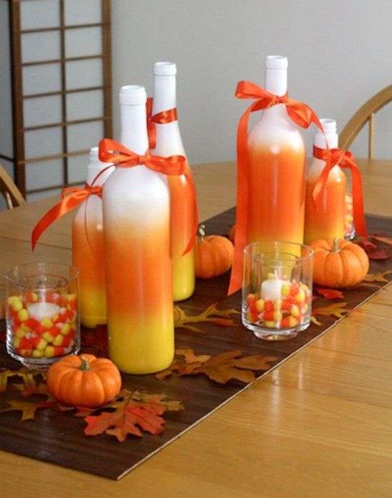 Bottiglie arancioni come centrotavola di Halloween